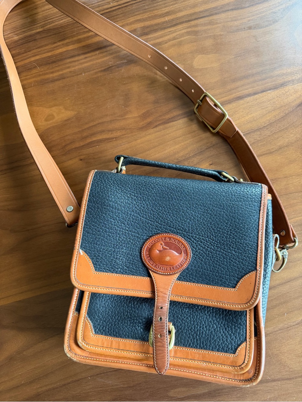 Dooney & Bourke Black and Tan Pebbled Leather Messenger Bag